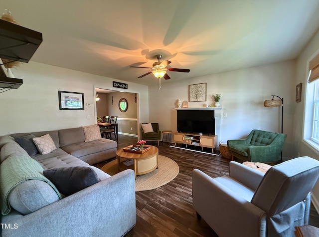 148 Langston Ridge Dr, Angier, NC 27501 - living area featuring dark wood-type flooring, ceiling fan, and baseboards