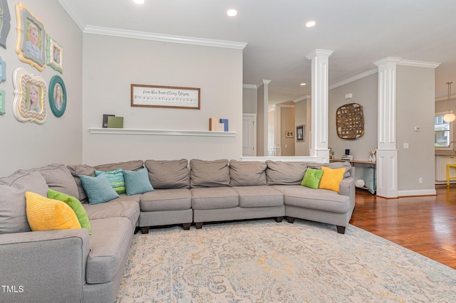 1138 Bexley Hills Bnd, Apex, NC 27502 - living area with ornate columns, wood finished floors, recessed lighting, and crown molding