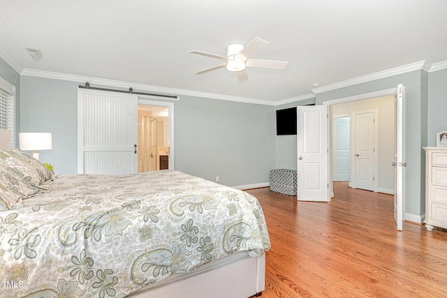1138 Bexley Hills Bnd, Apex, NC 27502 - bedroom with ornamental molding, light wood-type flooring, a barn door, and a ceiling fan