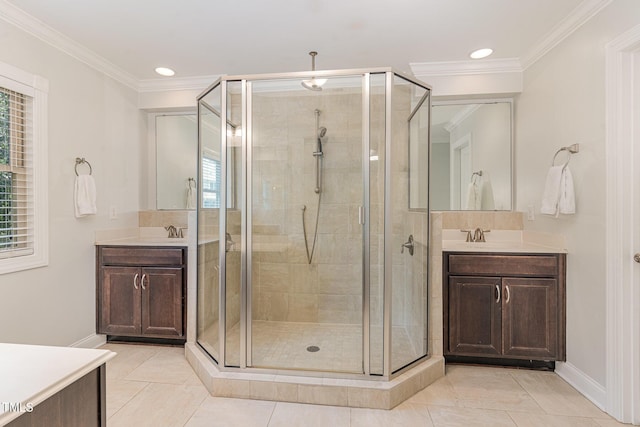 1138 Bexley Hills Bnd, Apex, NC 27502 - full bath featuring a stall shower, two vanities, ornamental molding, tile patterned flooring, and recessed lighting
