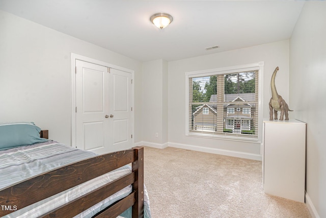 1138 Bexley Hills Bnd, Apex, NC 27502 - carpeted bedroom with baseboards and a closet