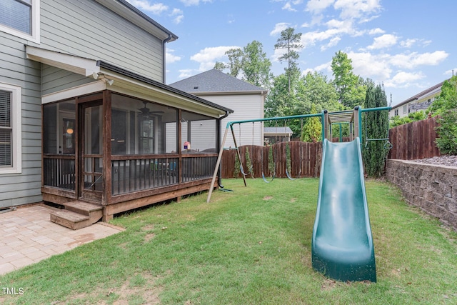 1138 Bexley Hills Bnd, Apex, NC 27502 - fenced backyard with a playground, a sunroom, and a patio area