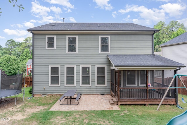 1138 Bexley Hills Bnd, Apex, NC 27502 - back of property with a trampoline, a patio area, a playground, and a sunroom