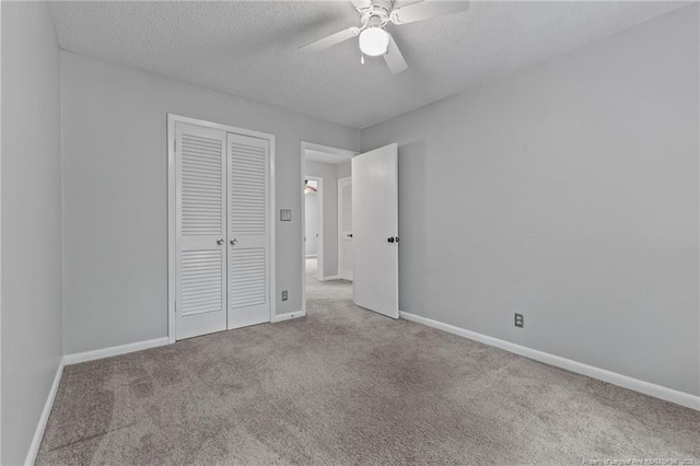 595 Winding Creek Rd Unit C, Fayetteville, NC 28305 - unfurnished bedroom with carpet flooring, a textured ceiling, a closet, and baseboards