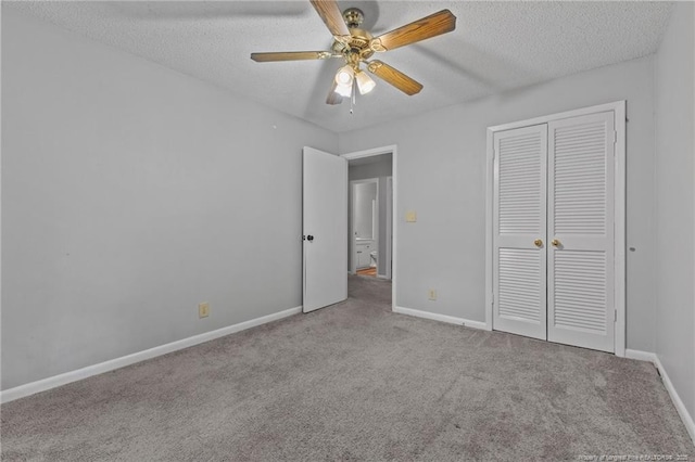 595 Winding Creek Rd Unit C, Fayetteville, NC 28305 - unfurnished bedroom featuring carpet flooring, a textured ceiling, baseboards, a closet, and ceiling fan