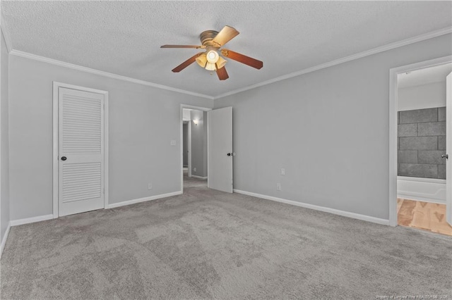 595 Winding Creek Rd Unit C, Fayetteville, NC 28305 - unfurnished bedroom featuring carpet flooring, crown molding, a textured ceiling, baseboards, and ensuite bath