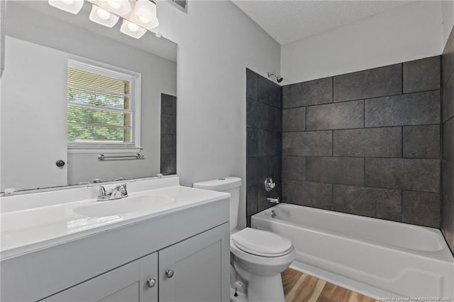 595 Winding Creek Rd Unit C, Fayetteville, NC 28305 - full bathroom featuring toilet, vanity, shower / tub combination, wood finished floors, and a textured ceiling