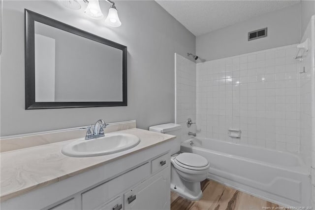595 Winding Creek Rd Unit C, Fayetteville, NC 28305 - full bath featuring toilet, vanity, wood finished floors, bathing tub / shower combination, and a textured ceiling