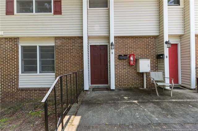 595 Winding Creek Rd Unit C, Fayetteville, NC 28305 - doorway to property featuring brick siding