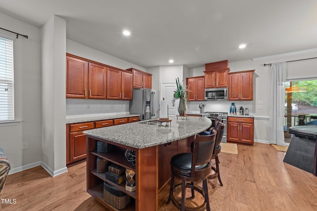 8132 Wheeler Woods Dr, Apex, NC 27539 - kitchen featuring stainless steel appliances, open shelves, light wood finished floors, decorative backsplash, and recessed lighting