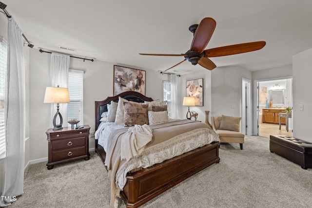 8132 Wheeler Woods Dr, Apex, NC 27539 - bedroom featuring light colored carpet, ensuite bathroom, a ceiling fan, and baseboards