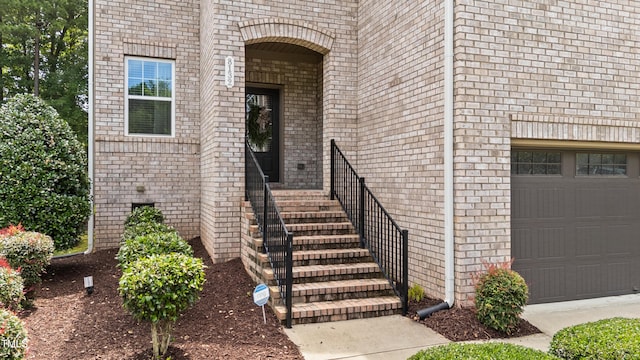 8132 Wheeler Woods Dr, Apex, NC 27539 - property entrance featuring a garage and brick siding