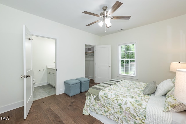 1318 N Alston Ave, Durham, NC 27701 - bedroom with dark wood-style floors, ensuite bath, baseboards, ceiling fan, and a closet