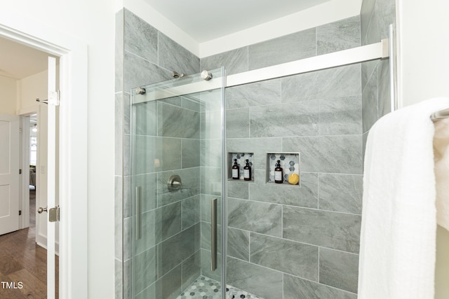 1318 N Alston Ave, Durham, NC 27701 - bathroom featuring a shower stall and wood finished floors