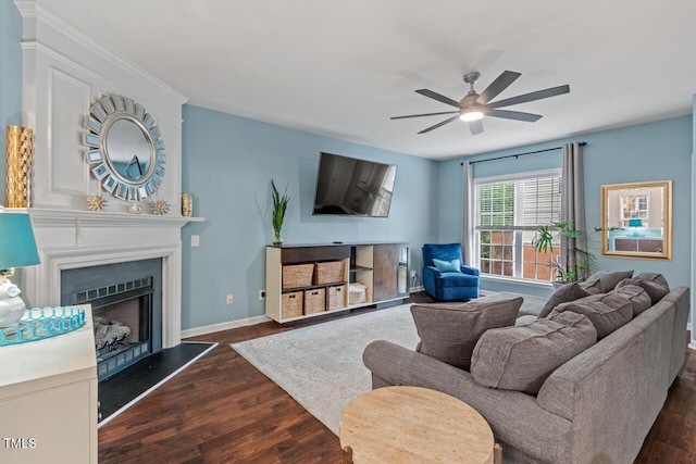 5505 Heather Garden Way, Raleigh, NC 27613 - living area with dark wood-style floors, a ceiling fan, and a fireplace