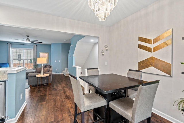 5505 Heather Garden Way, Raleigh, NC 27613 - dining space with dark wood-style flooring, a ceiling fan, a chandelier, and stairs