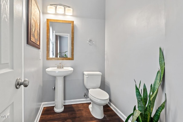5505 Heather Garden Way, Raleigh, NC 27613 - bathroom featuring baseboards and wood finished floors