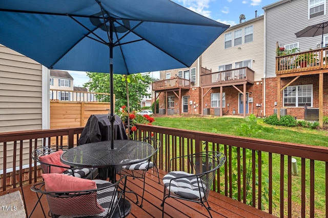 5505 Heather Garden Way, Raleigh, NC 27613 - wooden deck with outdoor dining area and a lawn