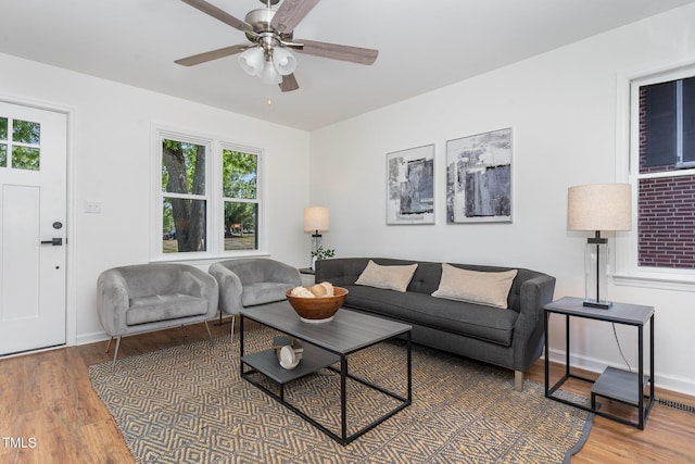 828 Cotton Pl, Raleigh, NC 27601 - living area featuring wood finished floors, plenty of natural light, ceiling fan, and baseboards