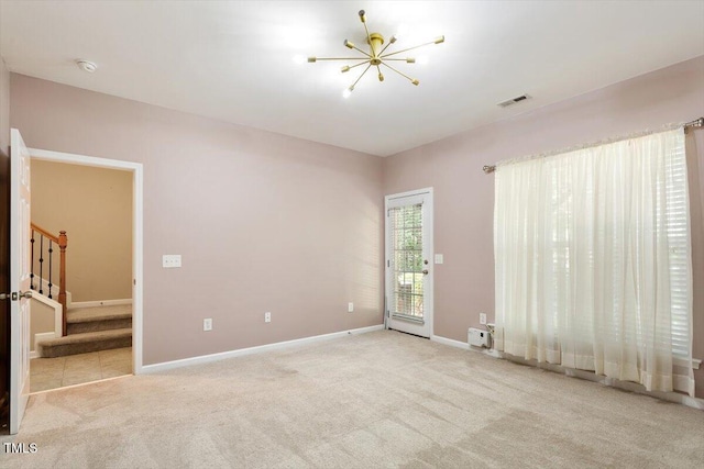 2614 Laurelcherry St, Raleigh, NC 27612 - carpeted empty room featuring stairs, a chandelier, a smoke detector, and baseboards