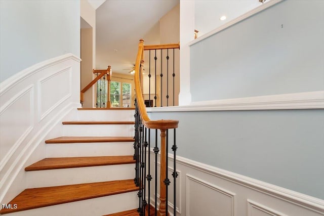 2614 Laurelcherry St, Raleigh, NC 27612 - stairway with a wainscoted wall and a decorative wall