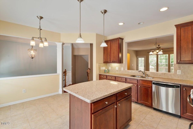 2614 Laurelcherry St, Raleigh, NC 27612 - kitchen featuring stainless steel dishwasher, a sink, decorative backsplash, hanging light fixtures, and recessed lighting