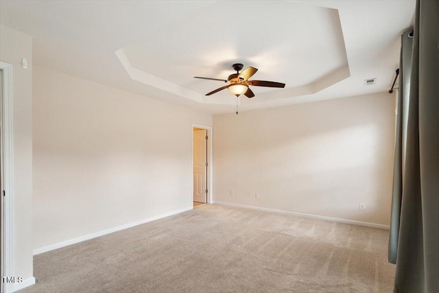2614 Laurelcherry St, Raleigh, NC 27612 - carpeted spare room with a raised ceiling, a ceiling fan, and baseboards
