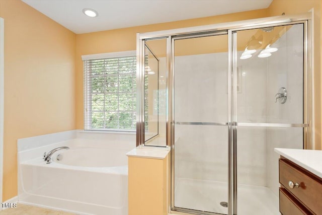 2614 Laurelcherry St, Raleigh, NC 27612 - full bath featuring a garden tub, a shower stall, and vanity