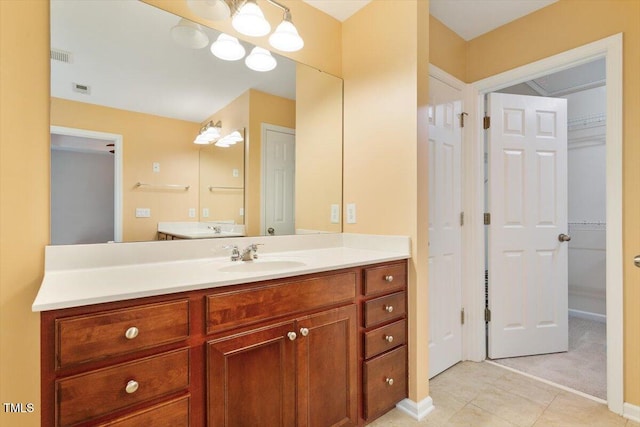 2614 Laurelcherry St, Raleigh, NC 27612 - bathroom with vanity, tile patterned floors, and a closet