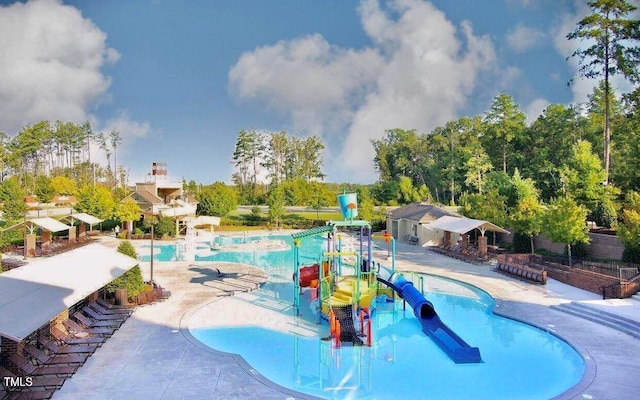 2018 Remington Oaks Cir, Cary, NC 27519 - community pool featuring a water play area, a water slide, and a patio area