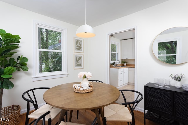 2523 Glendale Ave, Durham, NC 27704 - dining room with light wood-style floors and baseboards