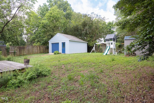 2523 Glendale Ave, Durham, NC 27704 - view of yard featuring a playground, an outbuilding, and a detached garage