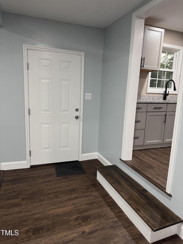 403 Oak St, Roanoke Rapids, NC 27870 - foyer entrance with dark wood-style floors and baseboards