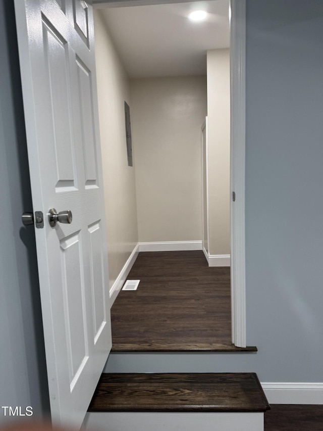 403 Oak St, Roanoke Rapids, NC 27870 - hallway featuring dark wood finished floors and baseboards