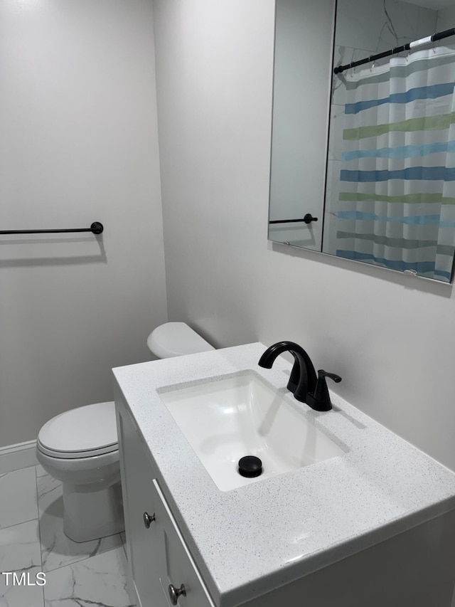 403 Oak St, Roanoke Rapids, NC 27870 - bathroom with toilet, vanity, a shower with shower curtain, and marble look tiles