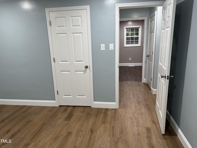 403 Oak St, Roanoke Rapids, NC 27870 - hall with baseboards and wood finished floors