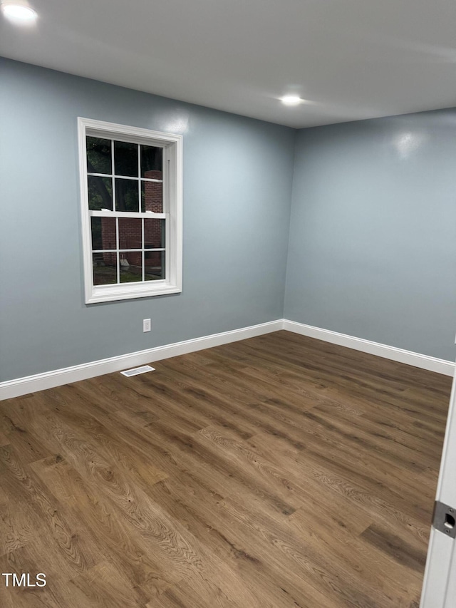 403 Oak St, Roanoke Rapids, NC 27870 - spare room featuring dark wood-style flooring, baseboards, and recessed lighting
