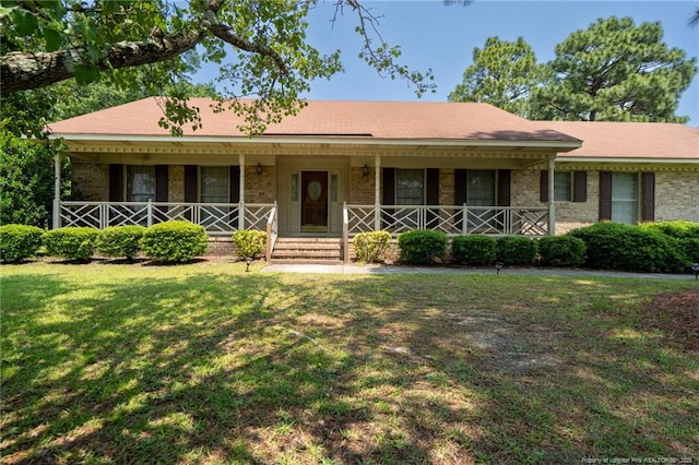 1608 Piney Creek Pl, Fayetteville, NC 28304 - ranch-style house with brick siding, a front lawn, and a porch