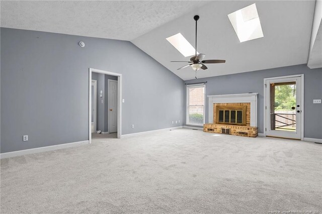 1608 Piney Creek Pl, Fayetteville, NC 28304 - unfurnished living room with a skylight, vaulted ceiling, ceiling fan, carpet, and healthy amount of natural light