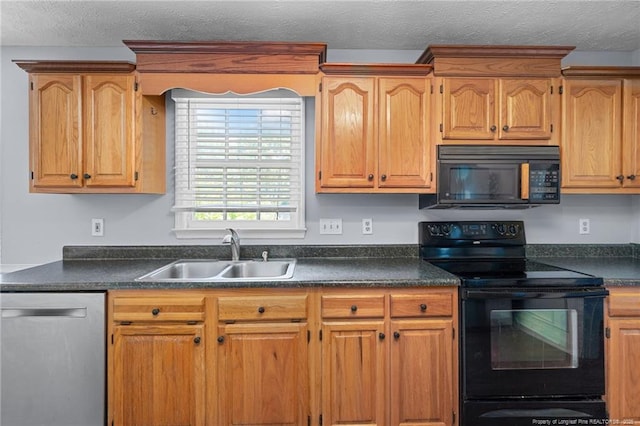 1608 Piney Creek Pl, Fayetteville, NC 28304 - kitchen featuring black appliances, a sink, dark countertops, and a textured ceiling