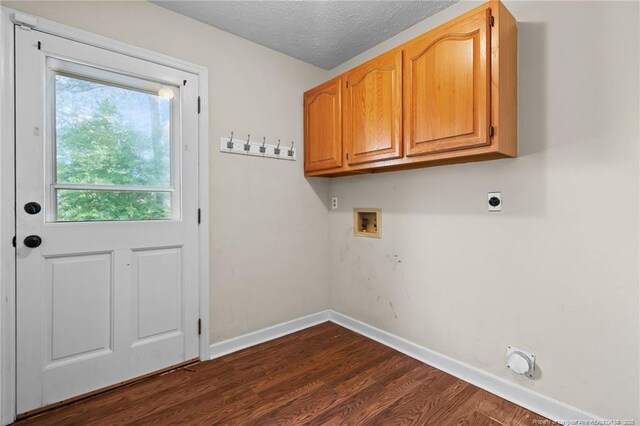 1608 Piney Creek Pl, Fayetteville, NC 28304 - washroom with hookup for a washing machine, hookup for an electric dryer, dark wood-type flooring, baseboards, and cabinet space
