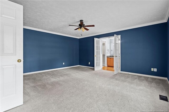 1608 Piney Creek Pl, Fayetteville, NC 28304 - unfurnished bedroom featuring carpet floors, baseboards, french doors, crown molding, and a ceiling fan