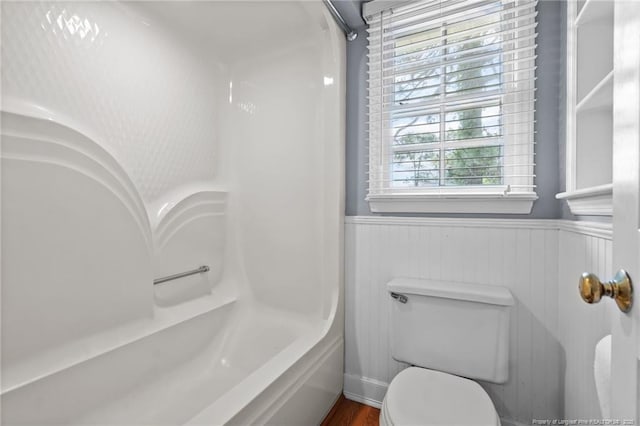 1608 Piney Creek Pl, Fayetteville, NC 28304 - bathroom with a wainscoted wall, toilet, bathtub / shower combination, and wood finished floors