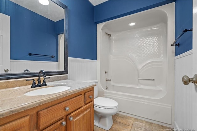 1608 Piney Creek Pl, Fayetteville, NC 28304 - bathroom featuring a wainscoted wall, vanity, toilet, and shower / bathtub combination