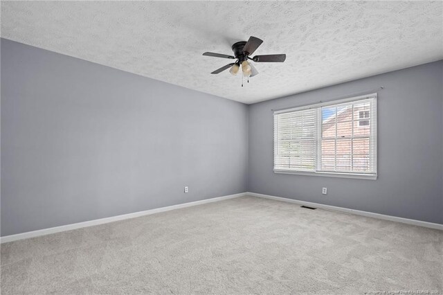 1608 Piney Creek Pl, Fayetteville, NC 28304 - spare room with a textured ceiling, carpet floors, baseboards, and a ceiling fan