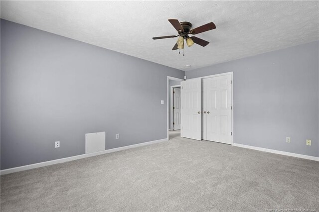 1608 Piney Creek Pl, Fayetteville, NC 28304 - unfurnished bedroom with carpet floors, baseboards, a textured ceiling, a closet, and ceiling fan