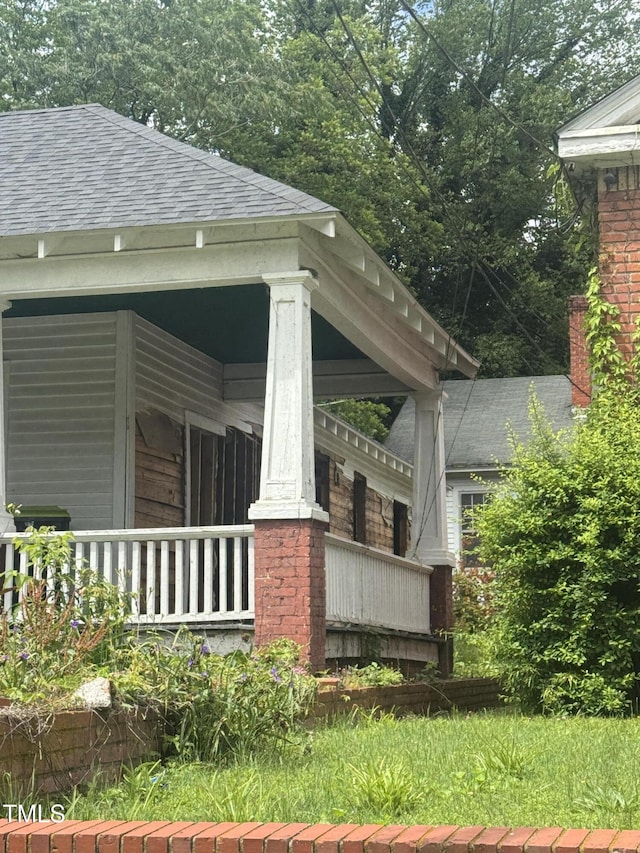 431 Charles St, Henderson, NC 27536 - view of side of home featuring roof with shingles and a porch