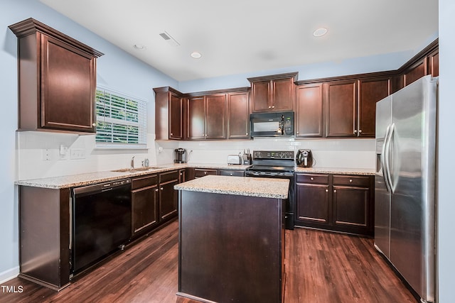 6729 Osprey Landing Dr, Wendell, NC 27591 - kitchen featuring black appliances, a sink, dark wood finished floors, dark brown cabinetry, and decorative backsplash