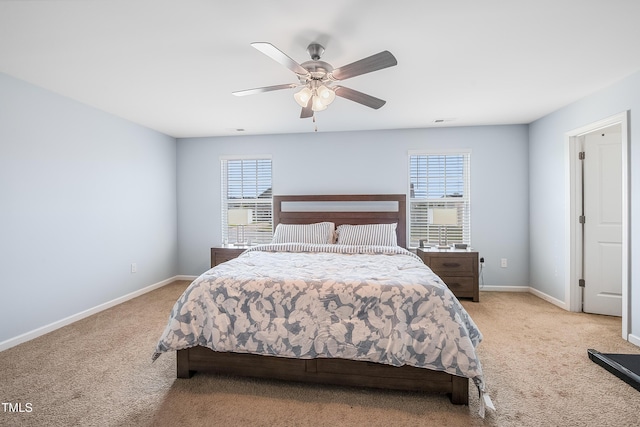 6729 Osprey Landing Dr, Wendell, NC 27591 - bedroom with light colored carpet, multiple windows, baseboards, and a ceiling fan