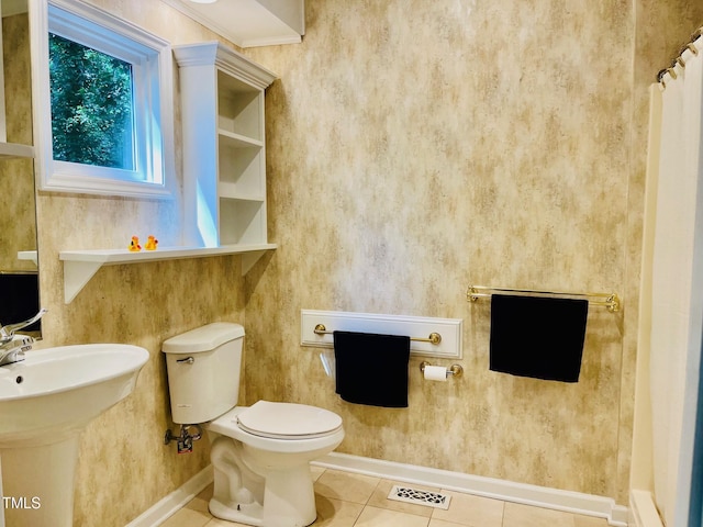 1512 Cumberland Rd, Chapel Hill, NC 27514 - full bathroom featuring baseboards, tile patterned flooring, toilet, and a shower with shower curtain